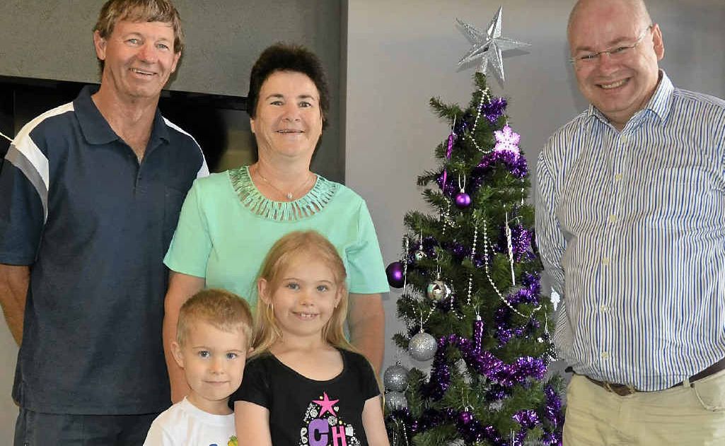 Trevor and Juanita Peck, with grandchildren Jett and Alyssa White, won the Warwick Daily News Christmas Light competition. Warwick Credit Union CEO Lewis von Stieglitz awards them with a $250 WCU bank account.